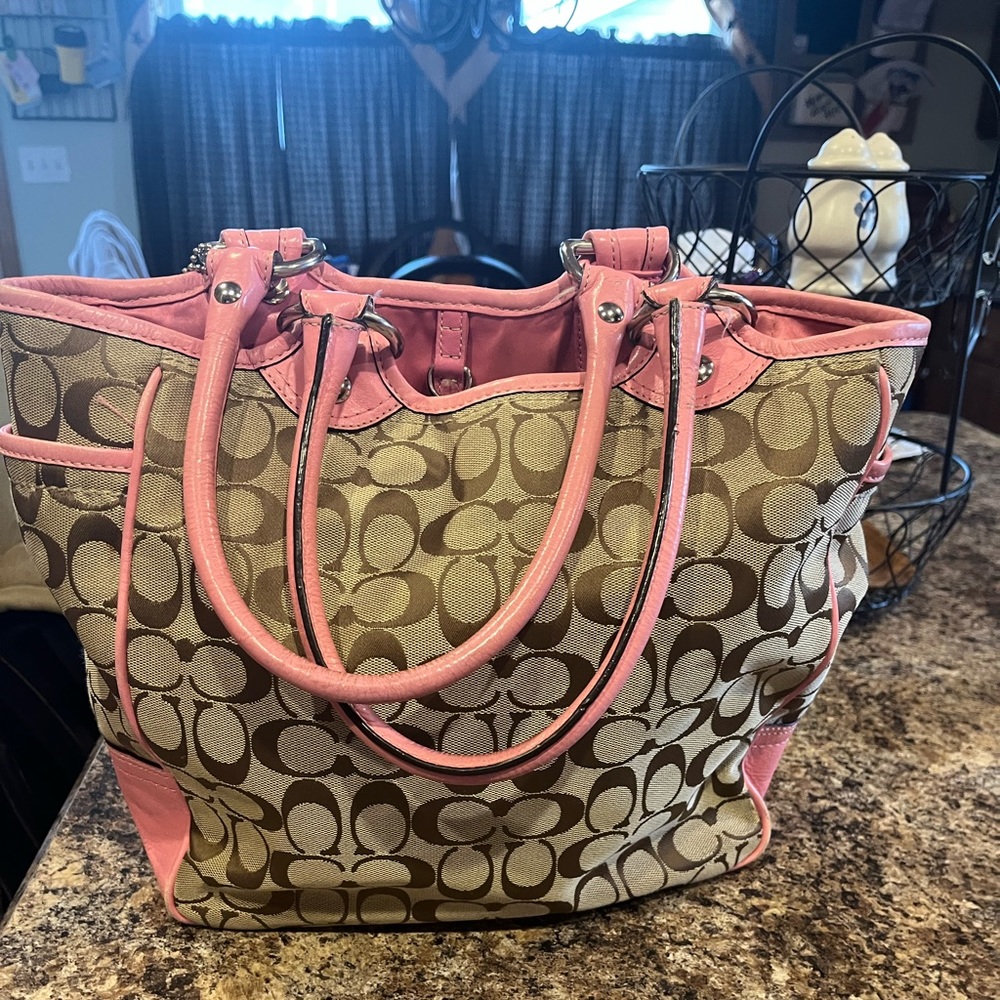 Coach hobo bag. Shows signs of wear on corners.